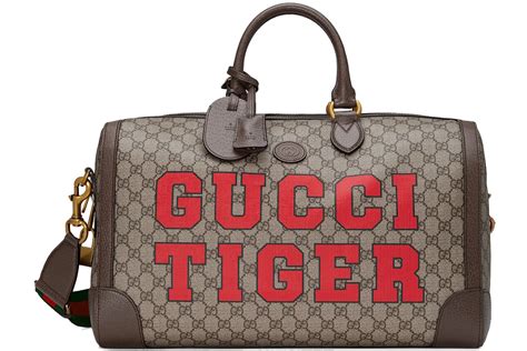 gucci bauletto grande|Large GG duffle bag in beige and ebony GG canvas .